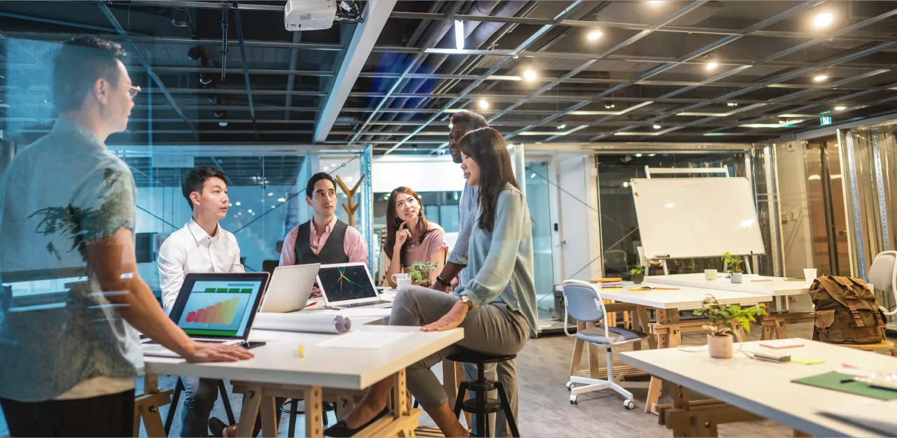Modern office workspace with people collaborating